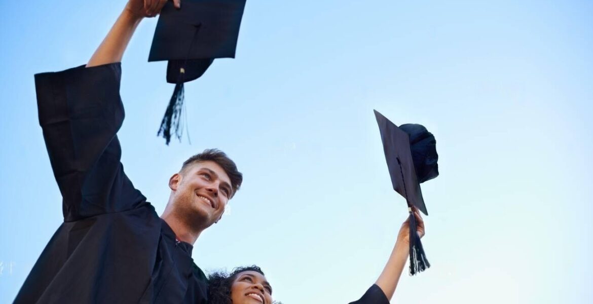 graduation-day-outdoors-shot-of-students-celebrating-on-graduation-day-2PTANM3-transformed